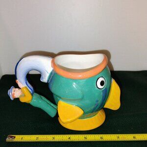 Vintage Coffeemate mug shaped like fish with fisherman handle